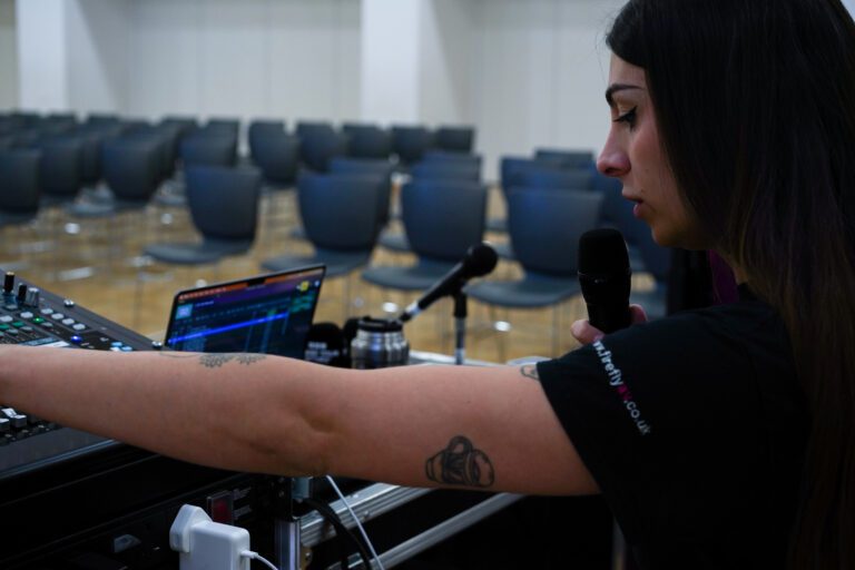 Image of firefly tech working on an allen& Heath desk
