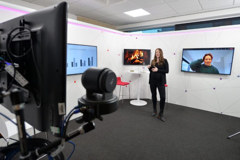 Horizon Leeds streaming studio with a lady on the TV and a lady in person