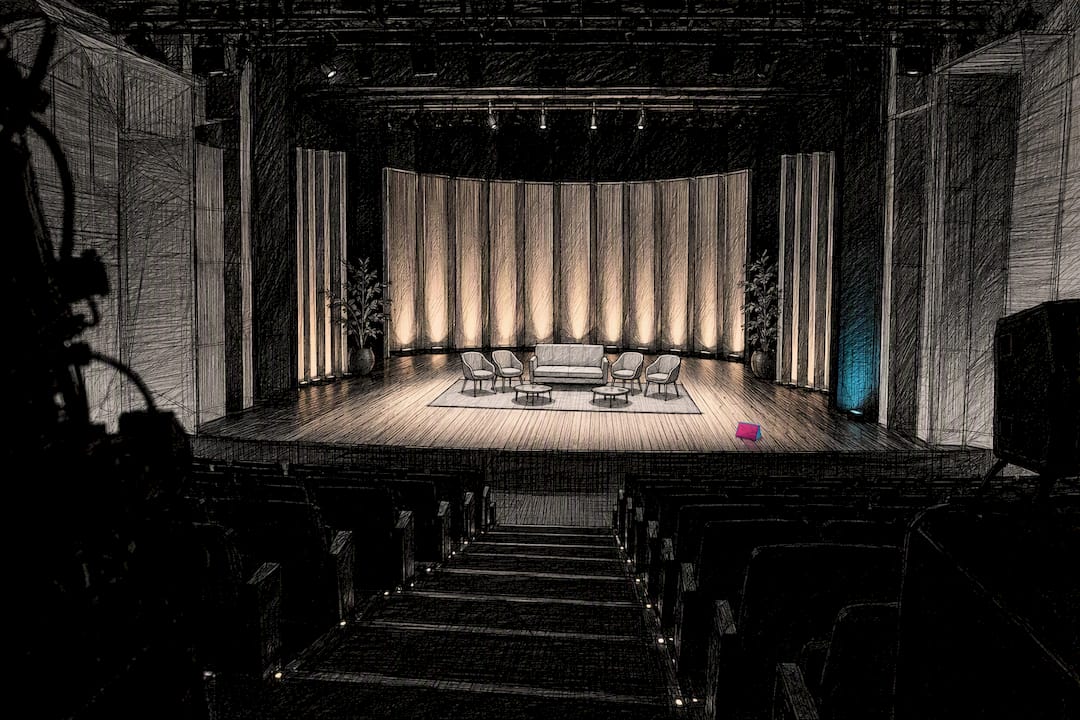 Conference stage set in a dark auditorium